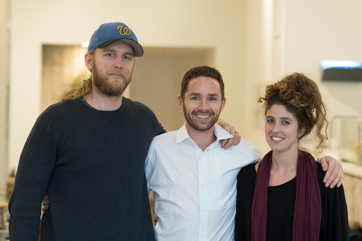 Jeffrey Boichuk, center, Mike and Sarah Keenan stand together for a picture