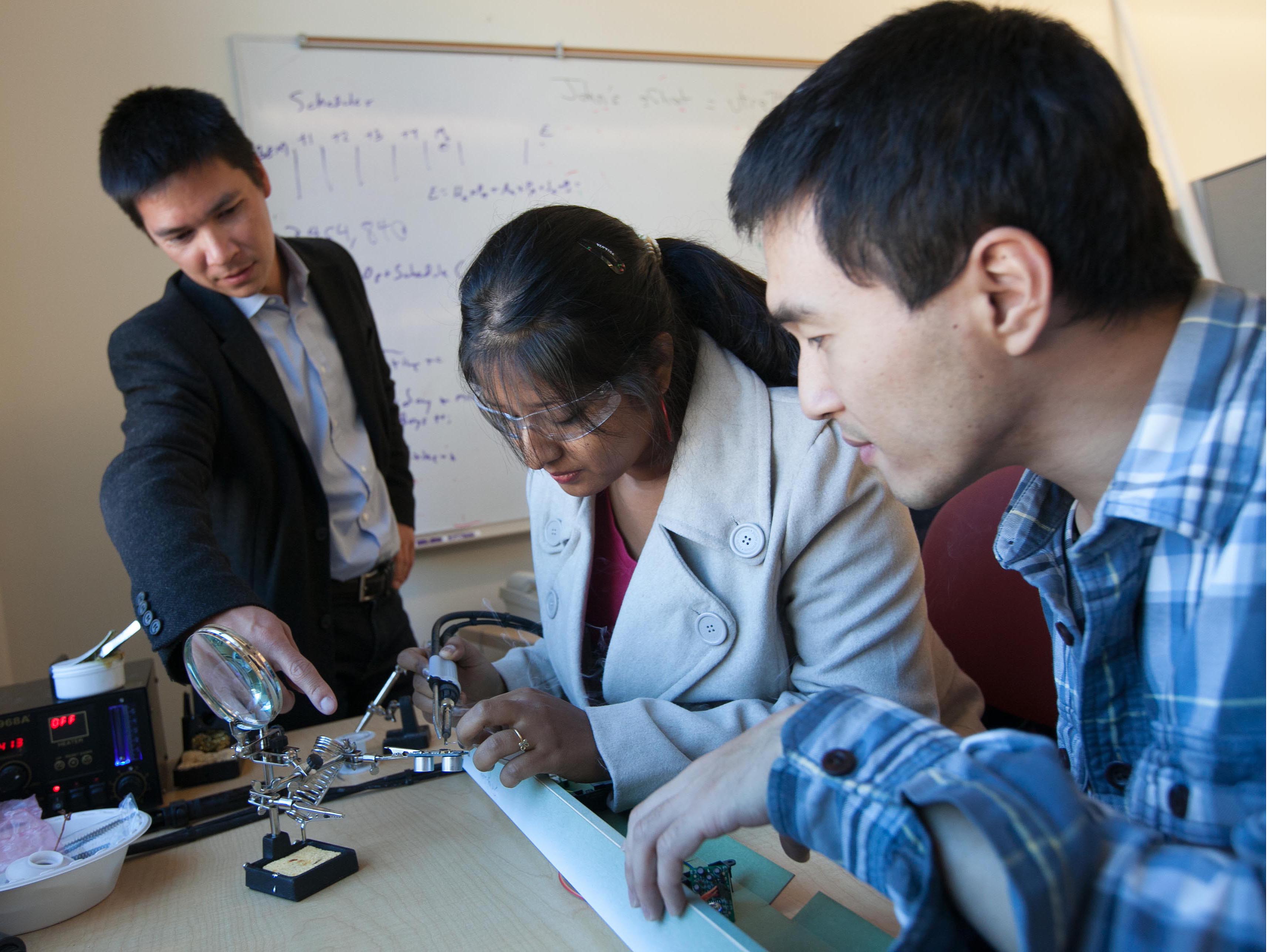 Kamin Whitehouse, left, with students