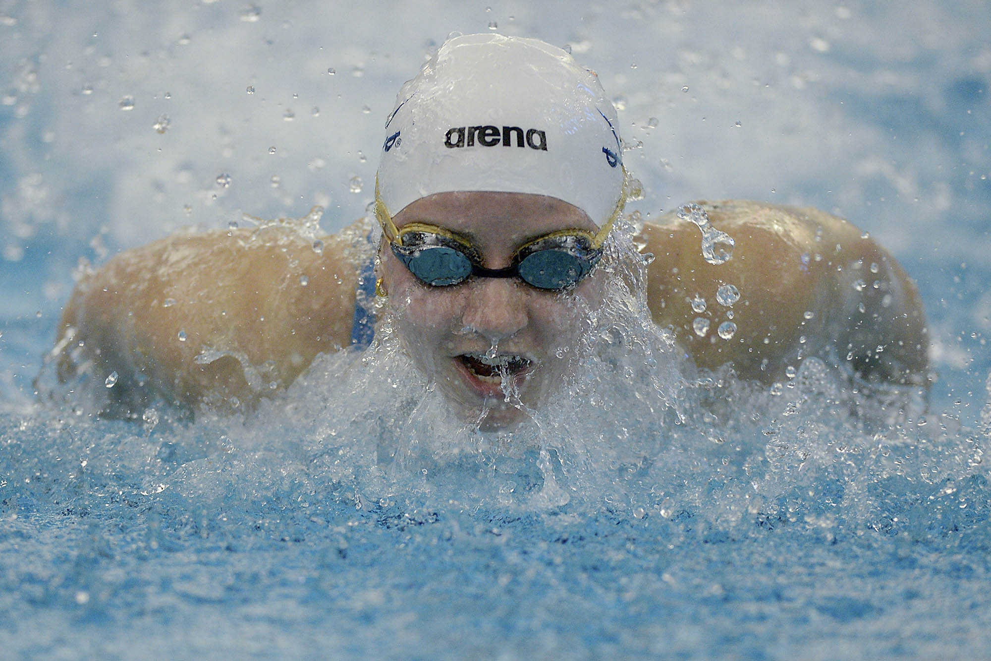 Kate Douglass swimming during a race