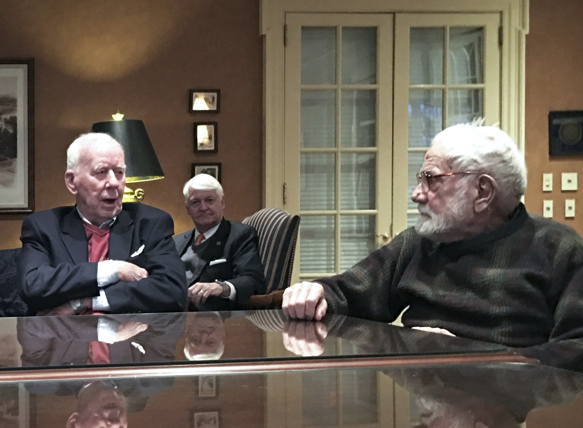 Kavanaugh sitting at table with Jack Bertram talking