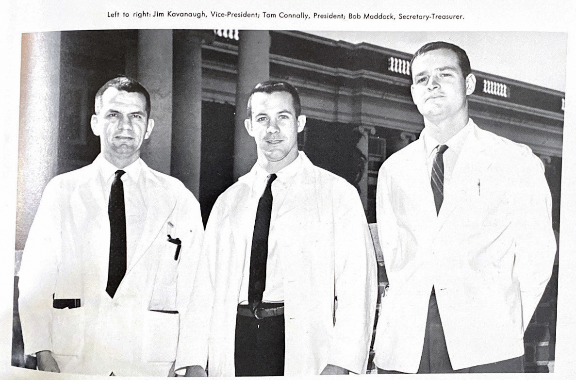 Kavanaugh, Tom Connolly and Bob Maddock stand togeher in their white coats as fourth-year medical students