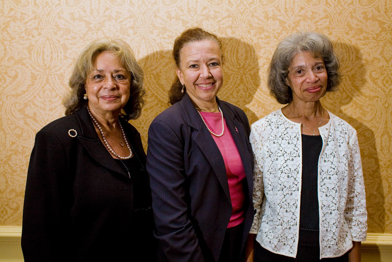 Dr. Vivian Pinn, left, and Dr. Barbara Favazza, right,  Susan “Syd” Dorsey, center, pose together for a picture