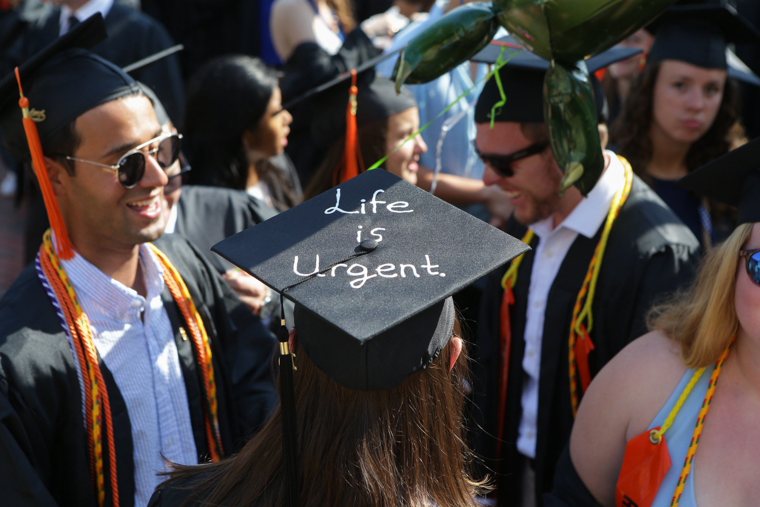 graduation cap reads Life is urgent