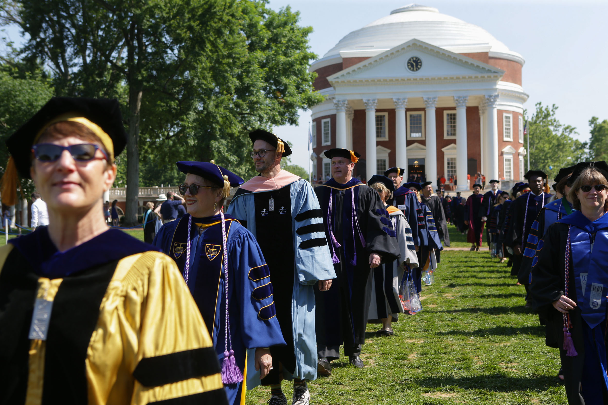 Graduates walking out of the Rotunda on the Lawn