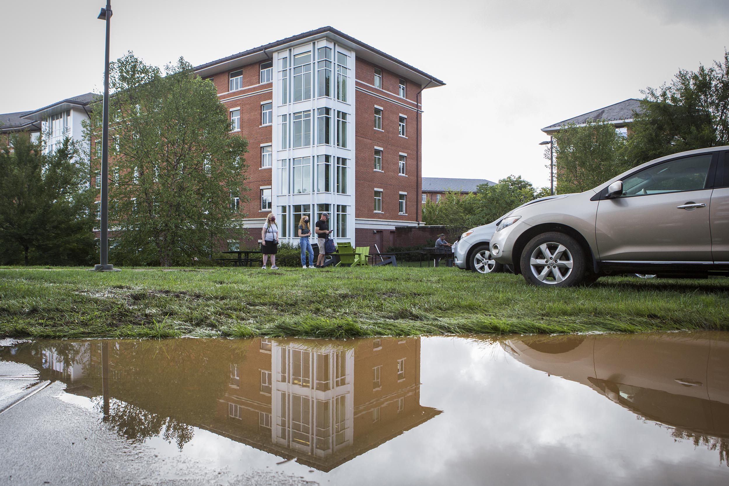Muddy water puddle in front of a dorm
