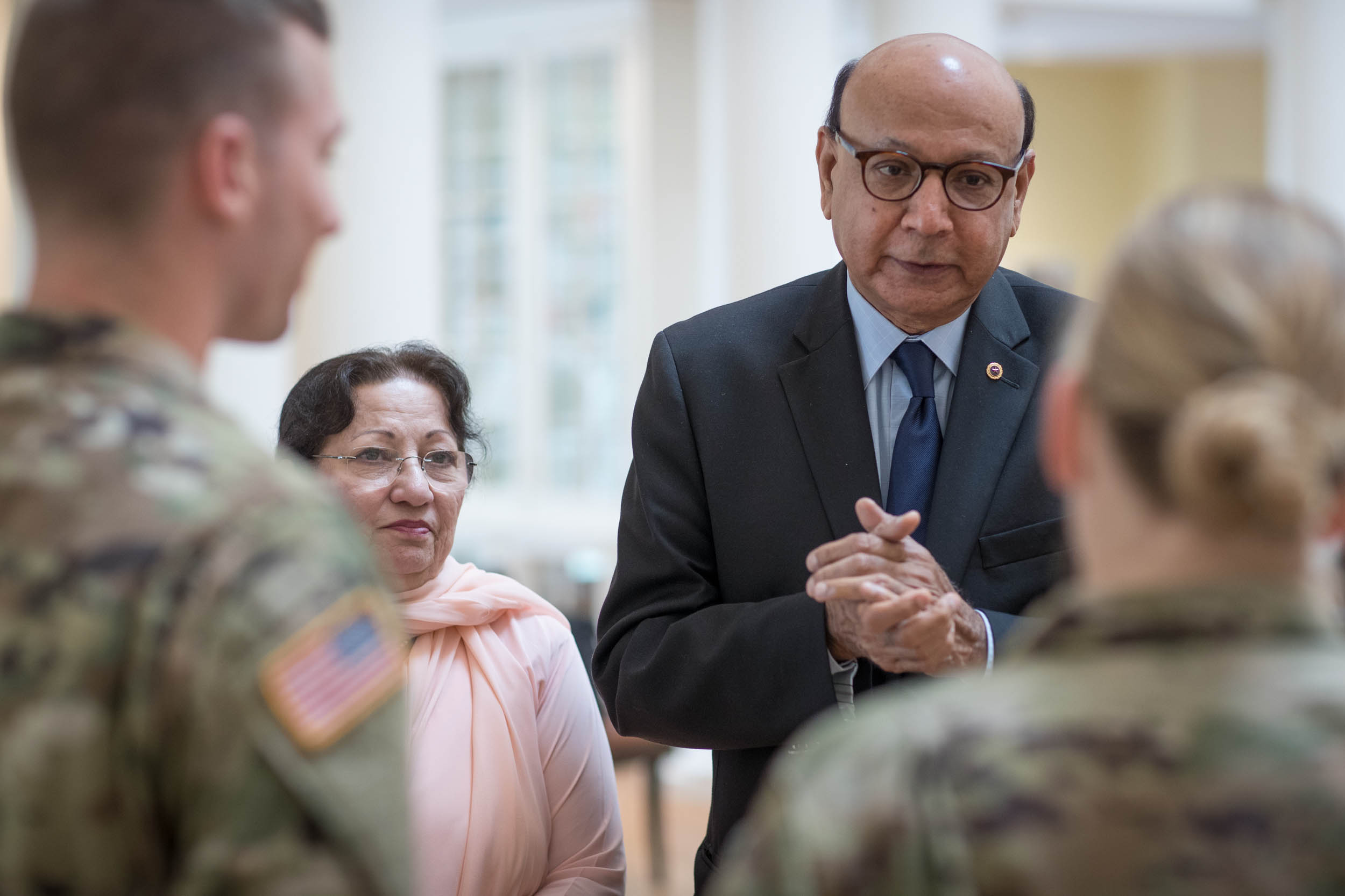 Khizr and Ghazala Khan talking to U.S. Army 2nd Lt. Christopher Bayer, left, and U.S. Army Capt. Jane A. Petrick