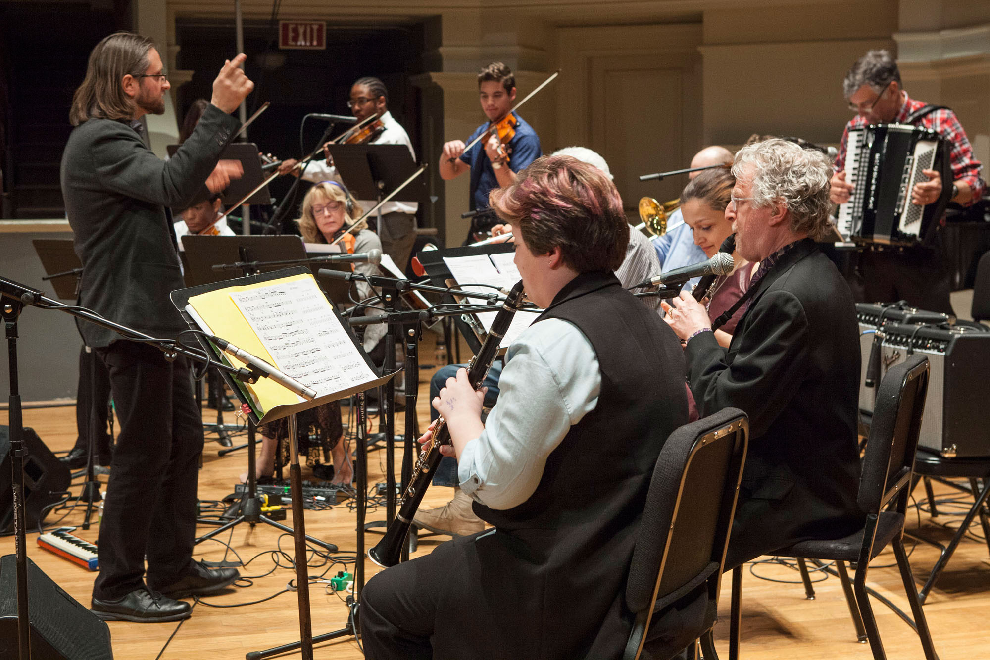 Shneyveys, left, leads the ensemble during Thursday’s concert.