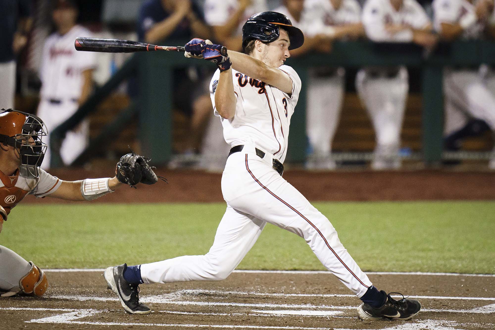 Kyle Teel  swings the bat during a baseball game