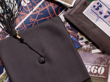 Graduation cap and various UVA fliers