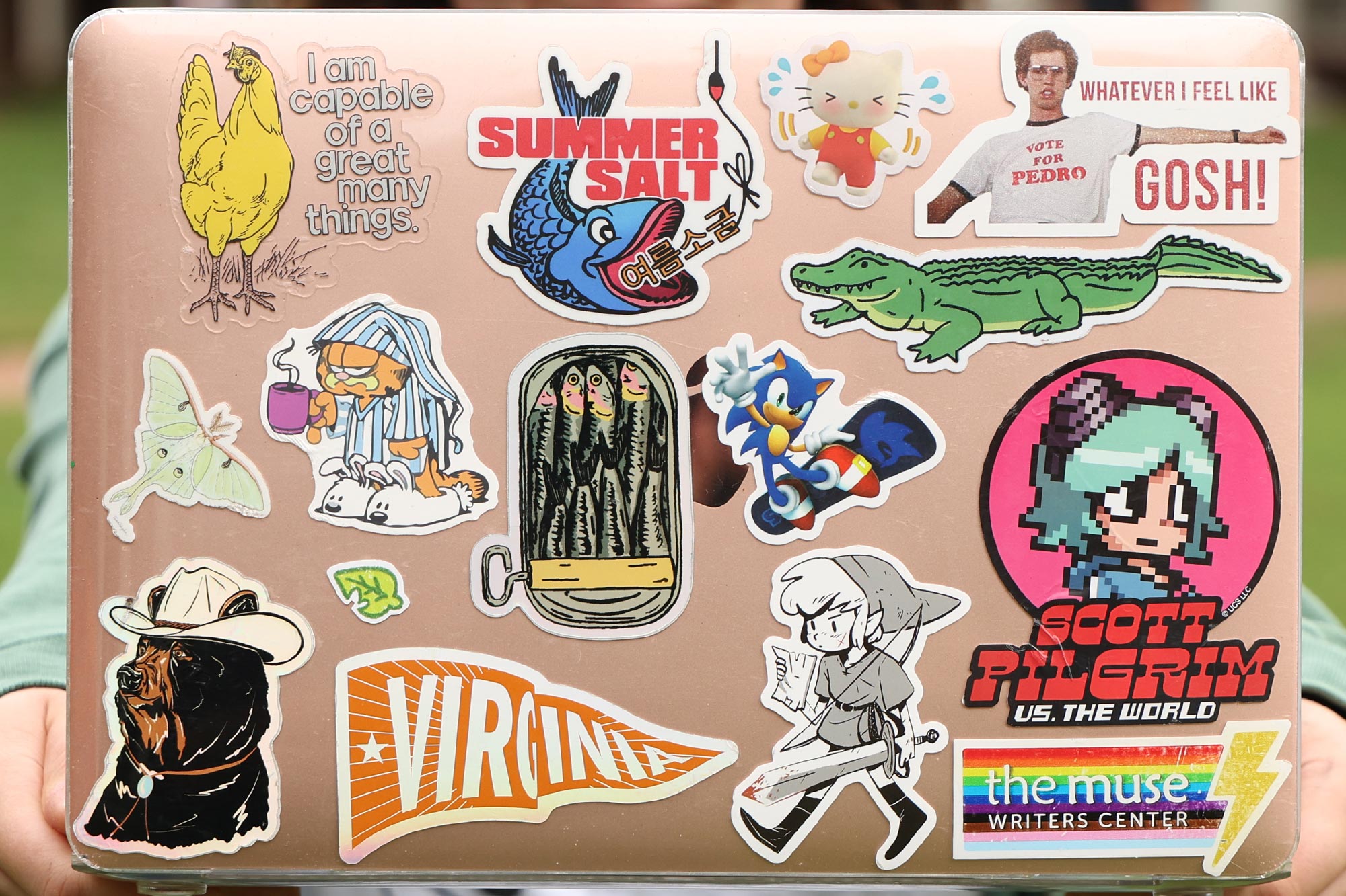 Sydney McClellan shows her laptop lid covered in stickers speaking to her love of film and video games.