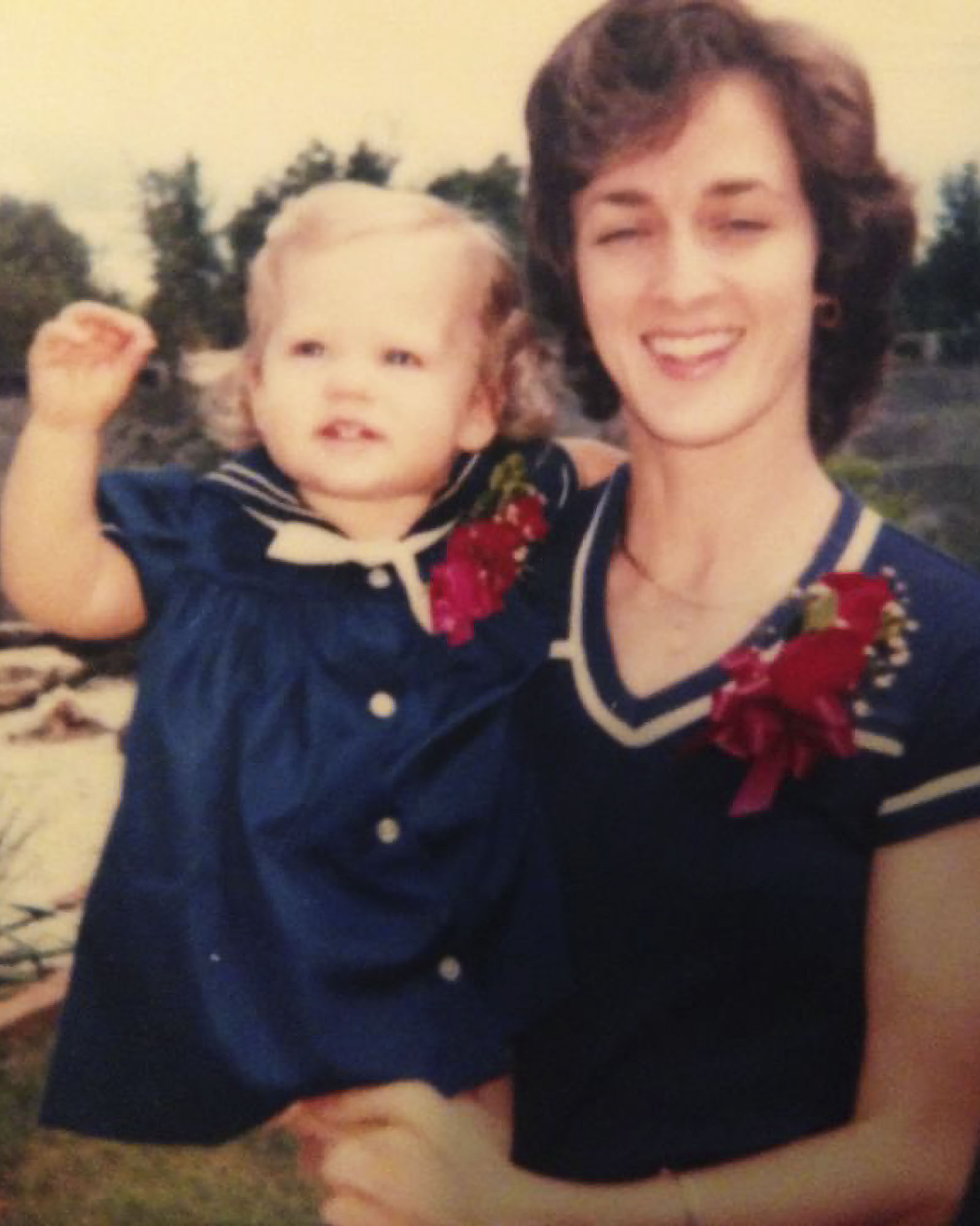 Picture of Lee Ann Johnson's mother holding her when she was a child. 