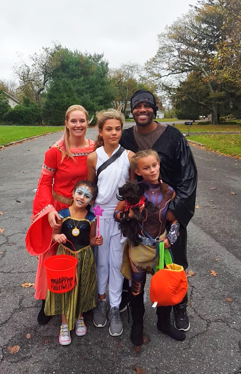 Marshall and Courtney Leonard with their three daughters dressed up in costumes for halloween