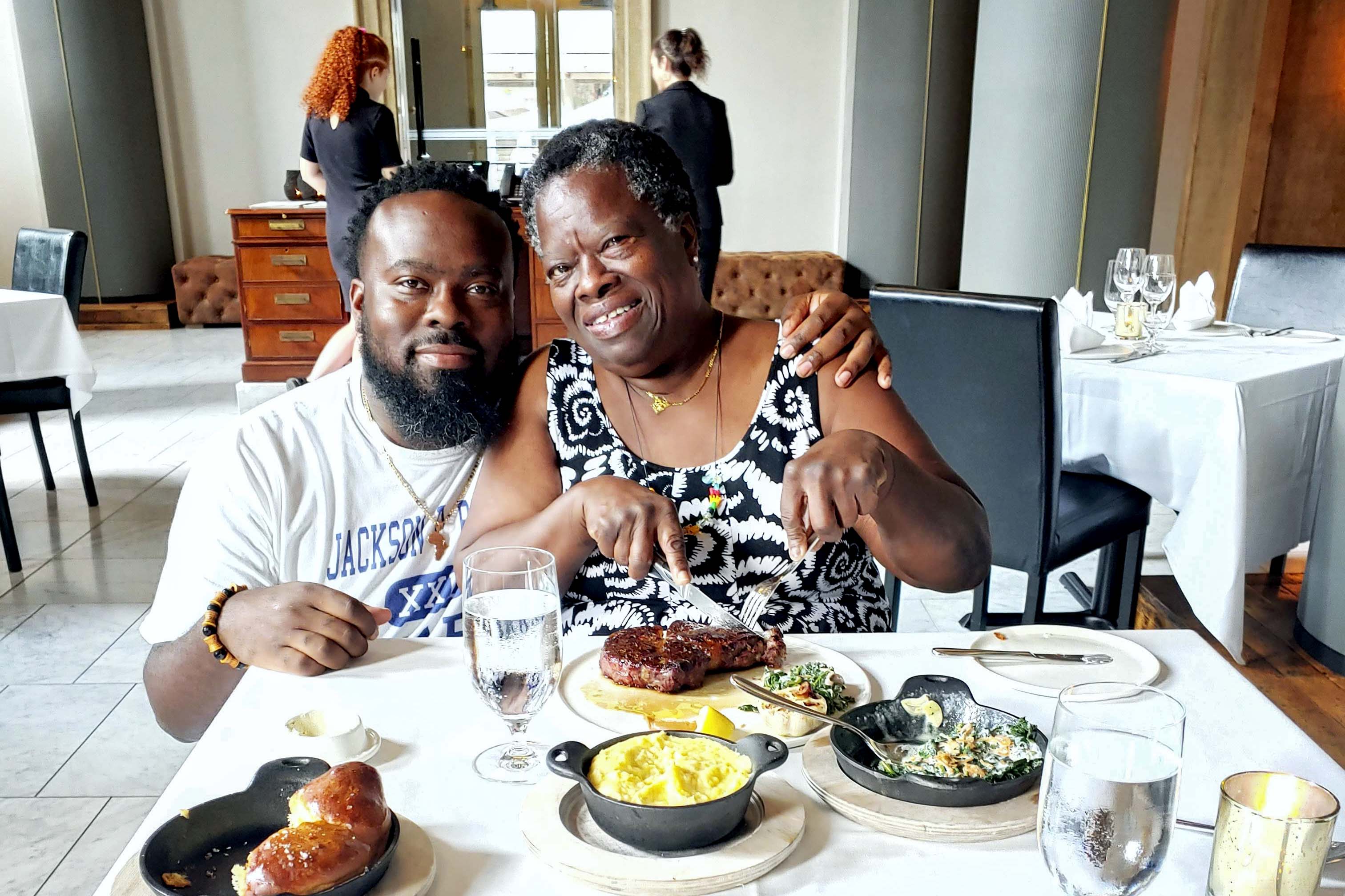 Lester Jackson and his mother Glenis eating together