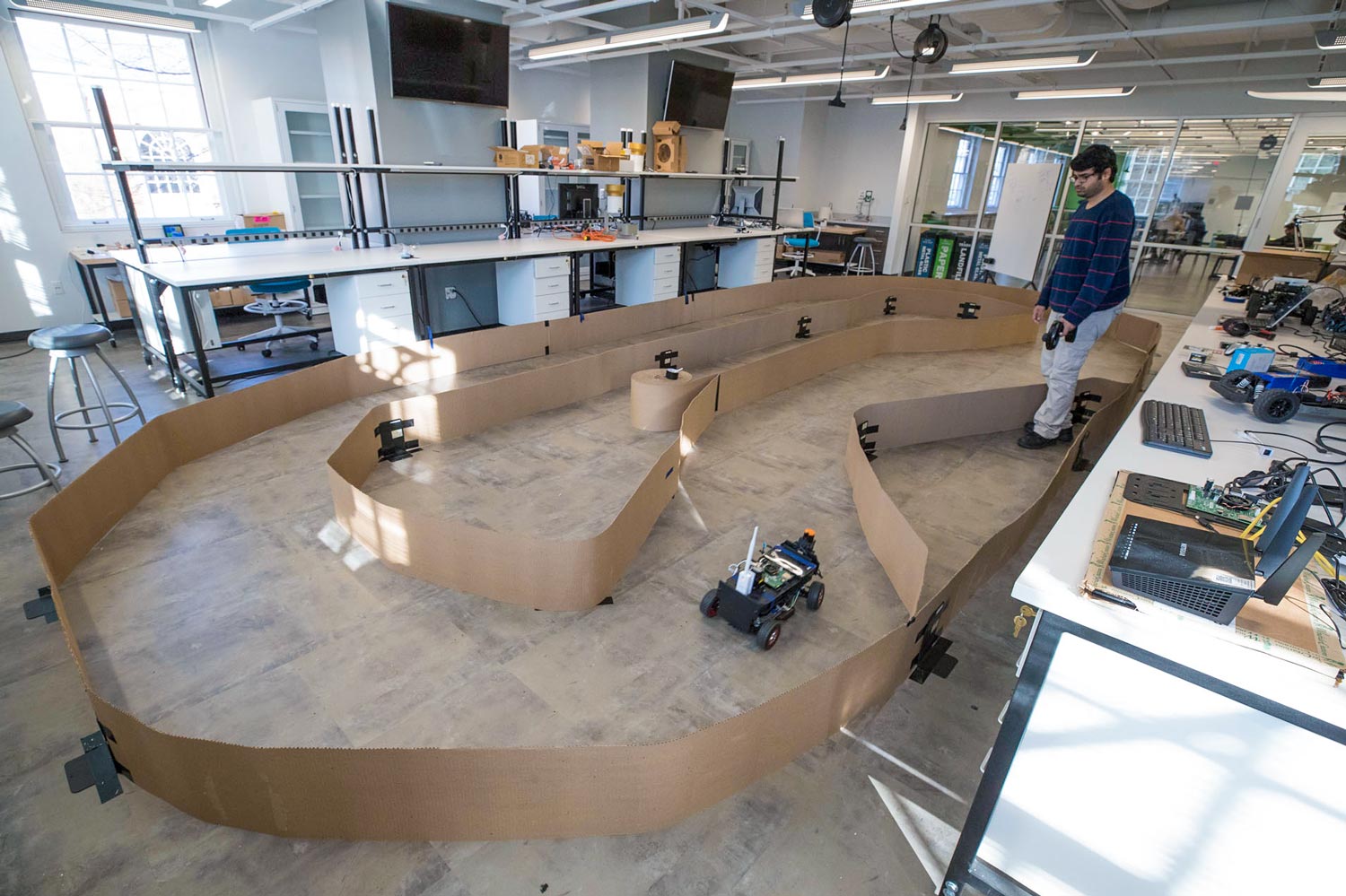  Small, autonomous vehicles navigate their way around a Link Lab track 