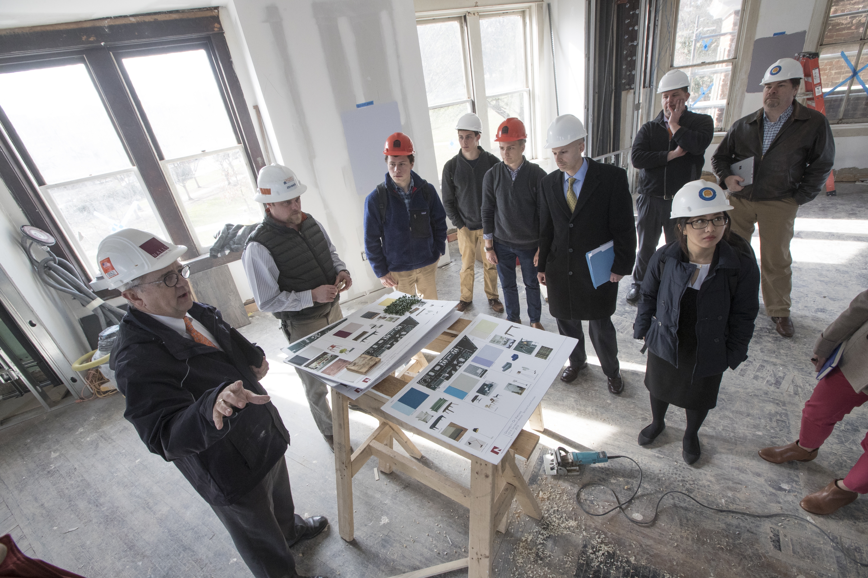 Project Architect Bob Nalls, a 1977 graduate of UVA’s School of Architecture, reviews color swatch selections with members of the 1515 planning committee.