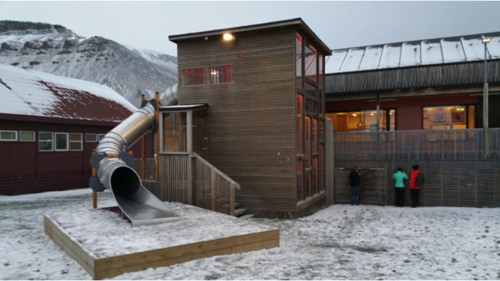 A kindergarten in Longyearbyen. The main levels of many buildings on Svalbard are elevated so that snow, propelled by high winds that create a sandstorm-like effect, can pass through slatted wooden structures underneath.