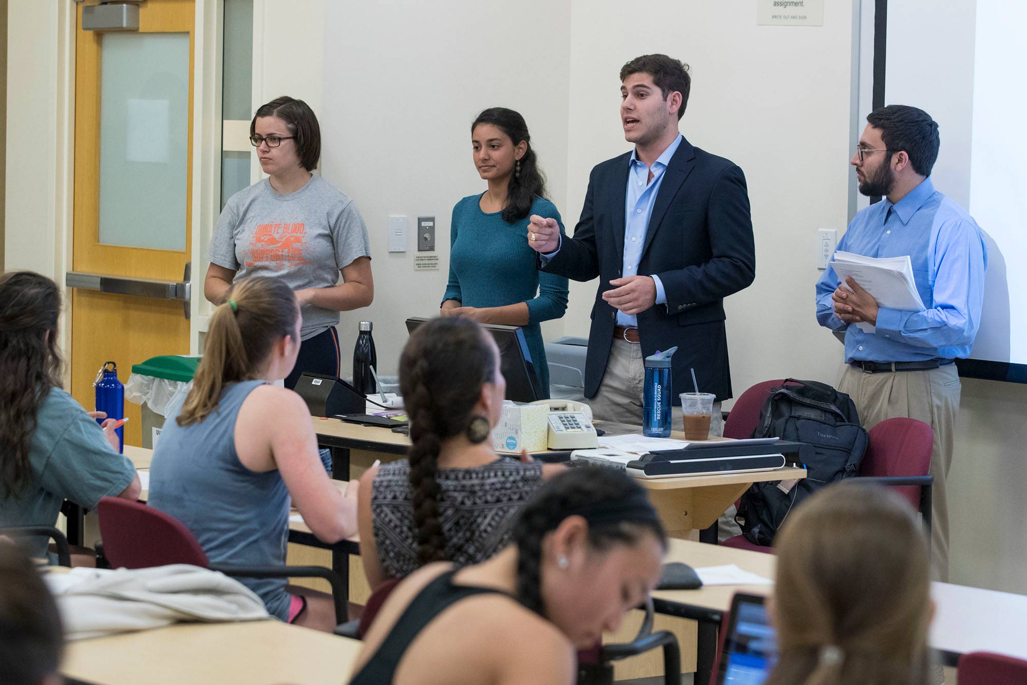 Sabhi Singh and Marc Blatt stand in front of a class speaking