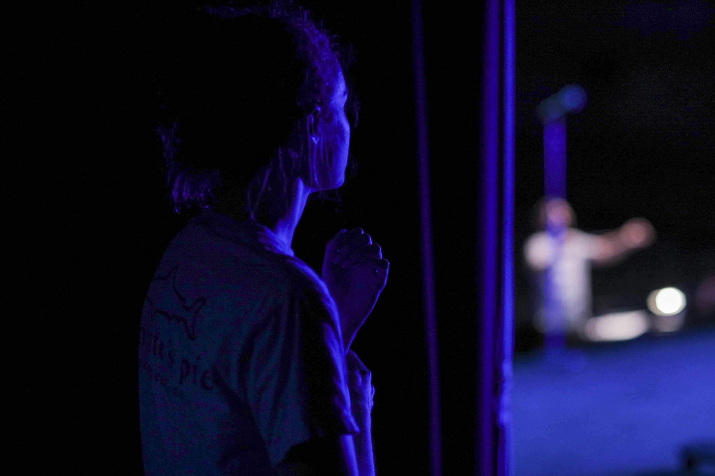 Person watching the stage from backstage