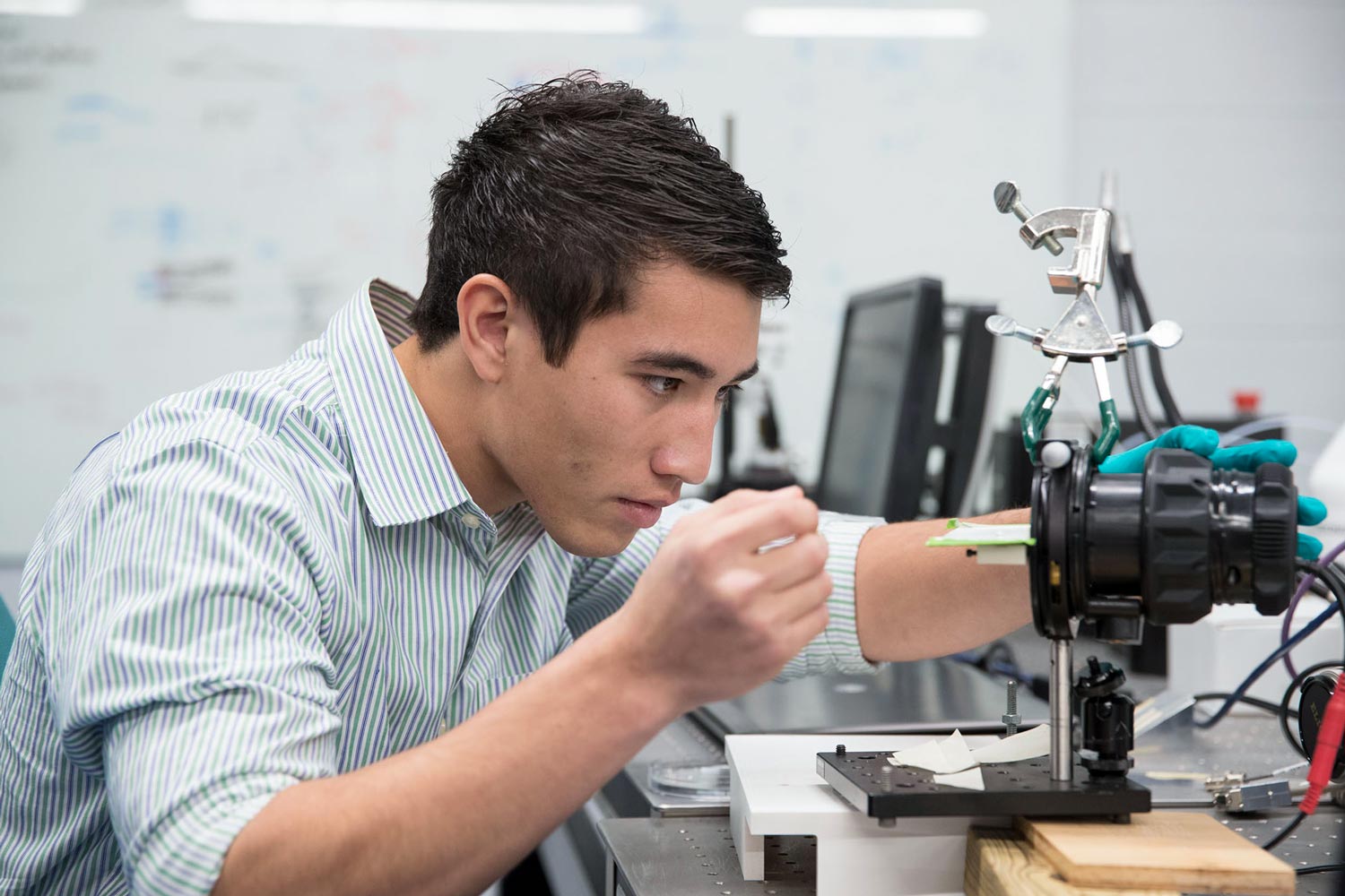 Matt Asper working with lab equipment