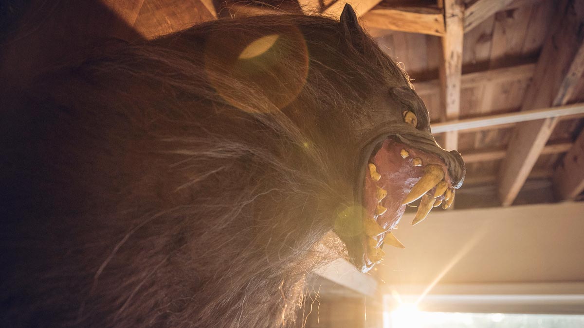 A werewolf mask mounted on a wall