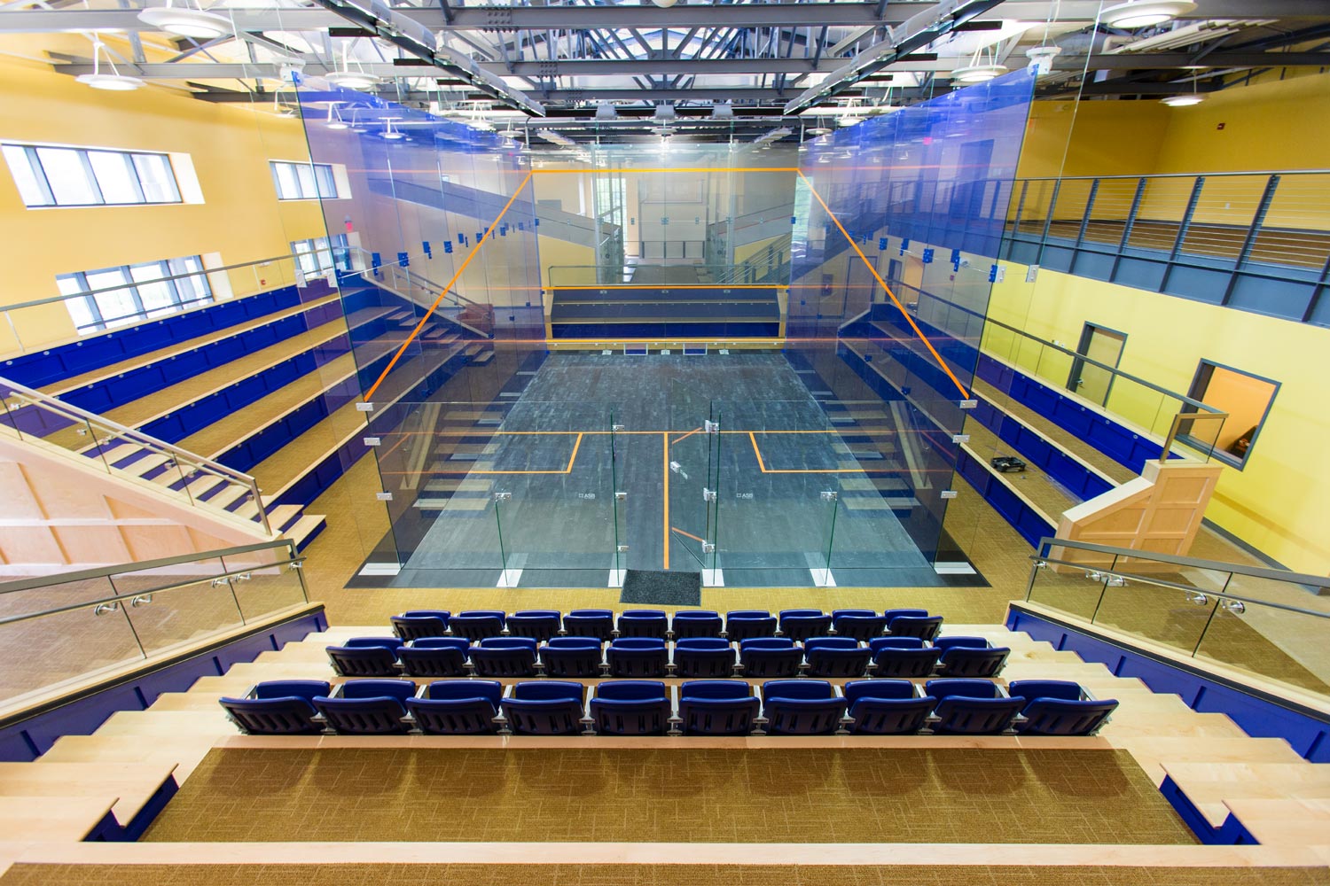 The McArthur Squash Court surrounded by chairs