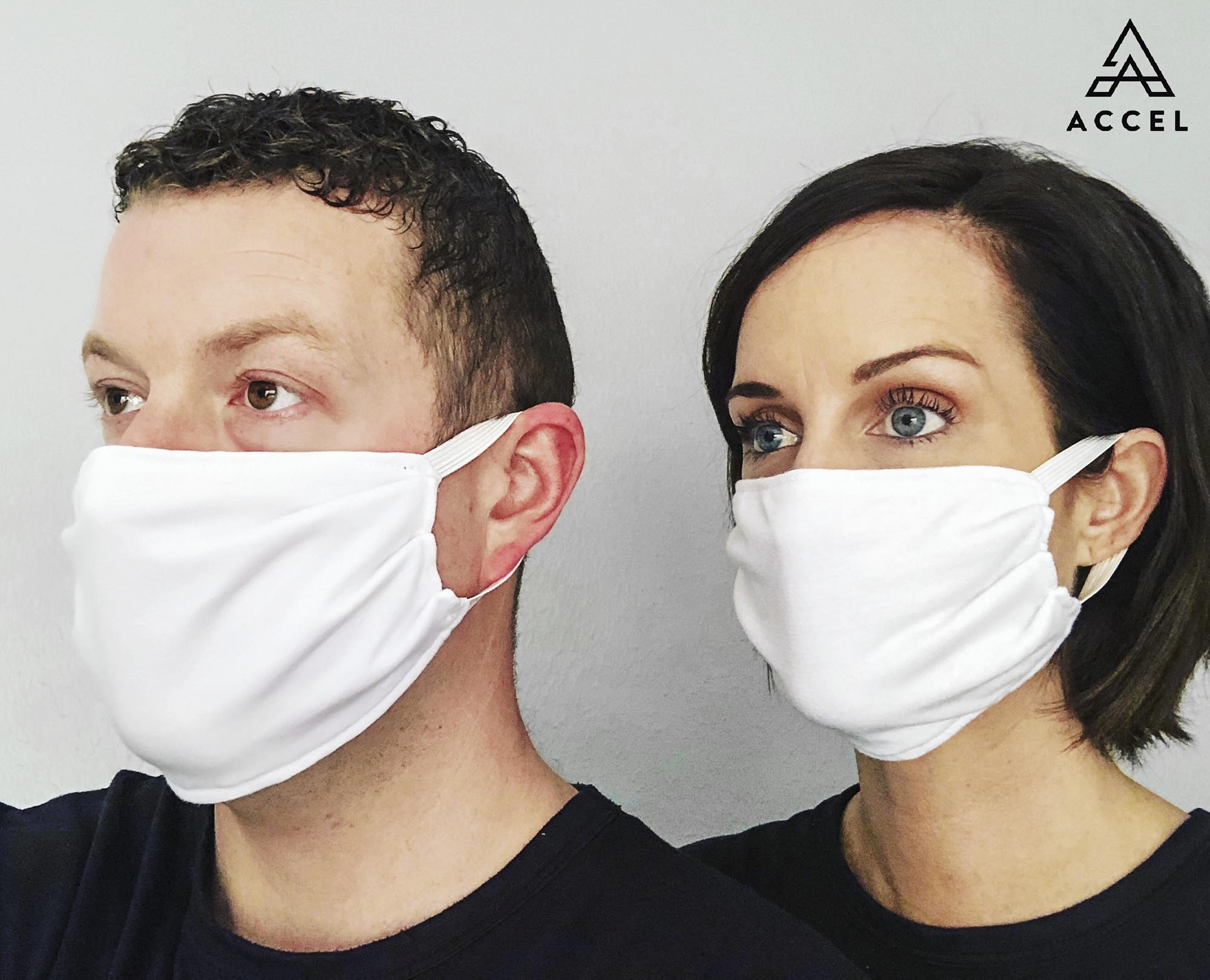 Kyle Eddings, left,Megan, right both wear a solid white facemask made my accel