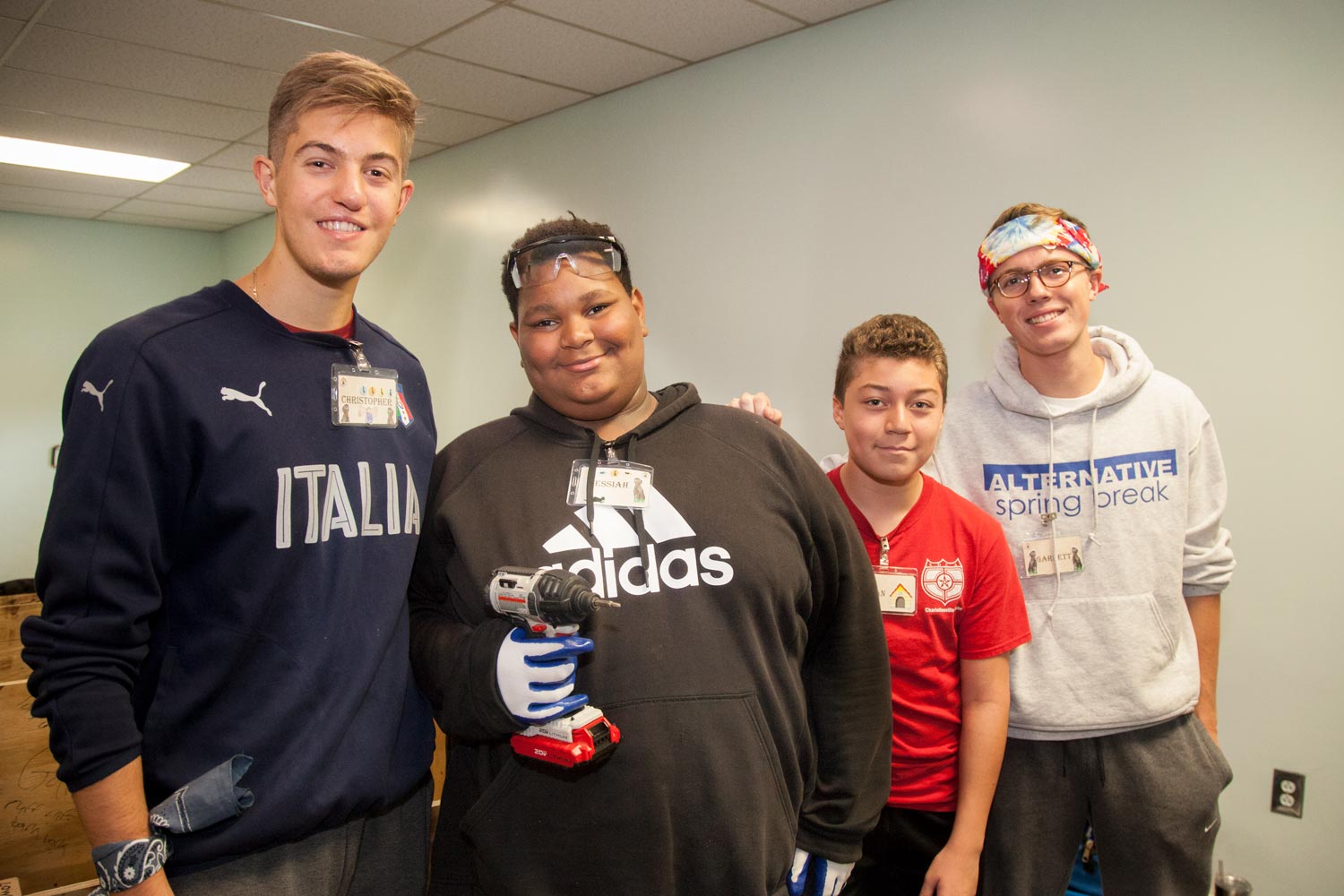 Chris Sausa, left, and Garrett Lukens, right, Messiah and Johan stand together for a group picture