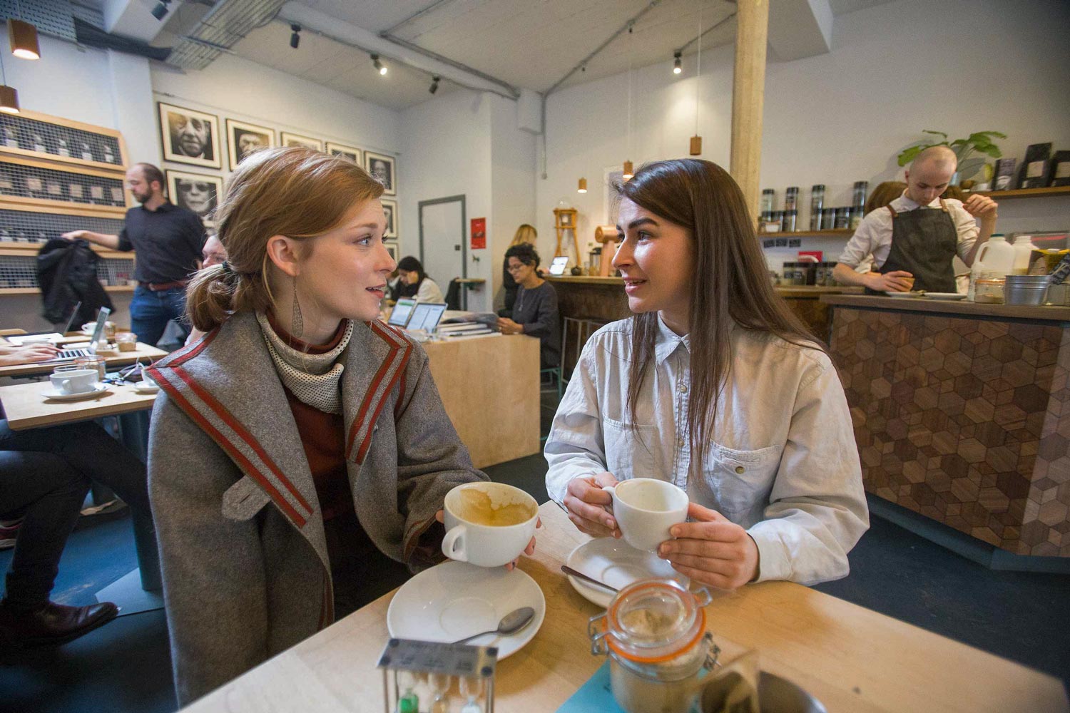 Cox, right, with her friend and fellow art historian, University of North Carolina graduate Meredith Miller, at Society Café, one of their favorite coffee shops in Oxford. 