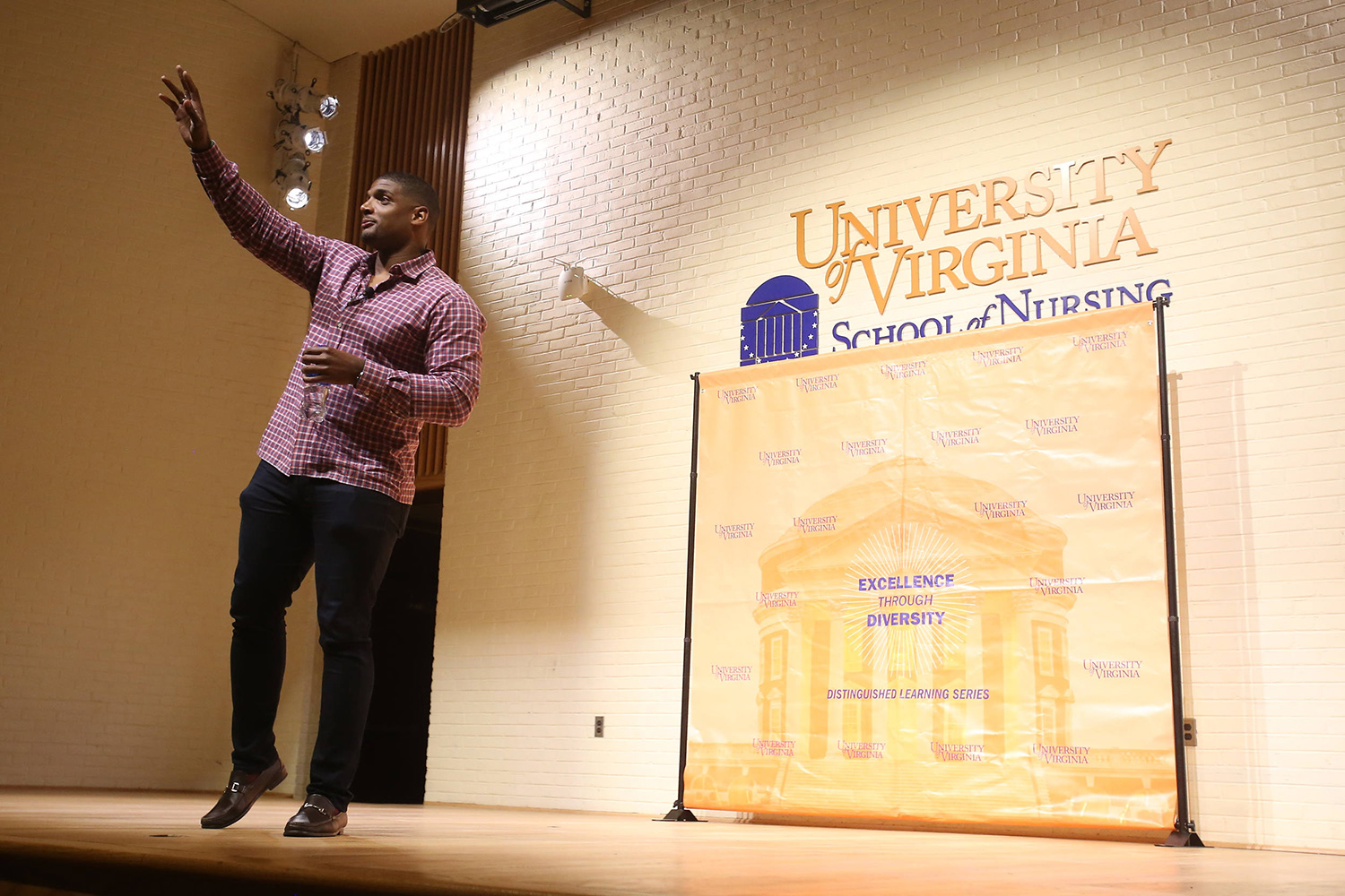 Michael Sam talking on stage to a crowd