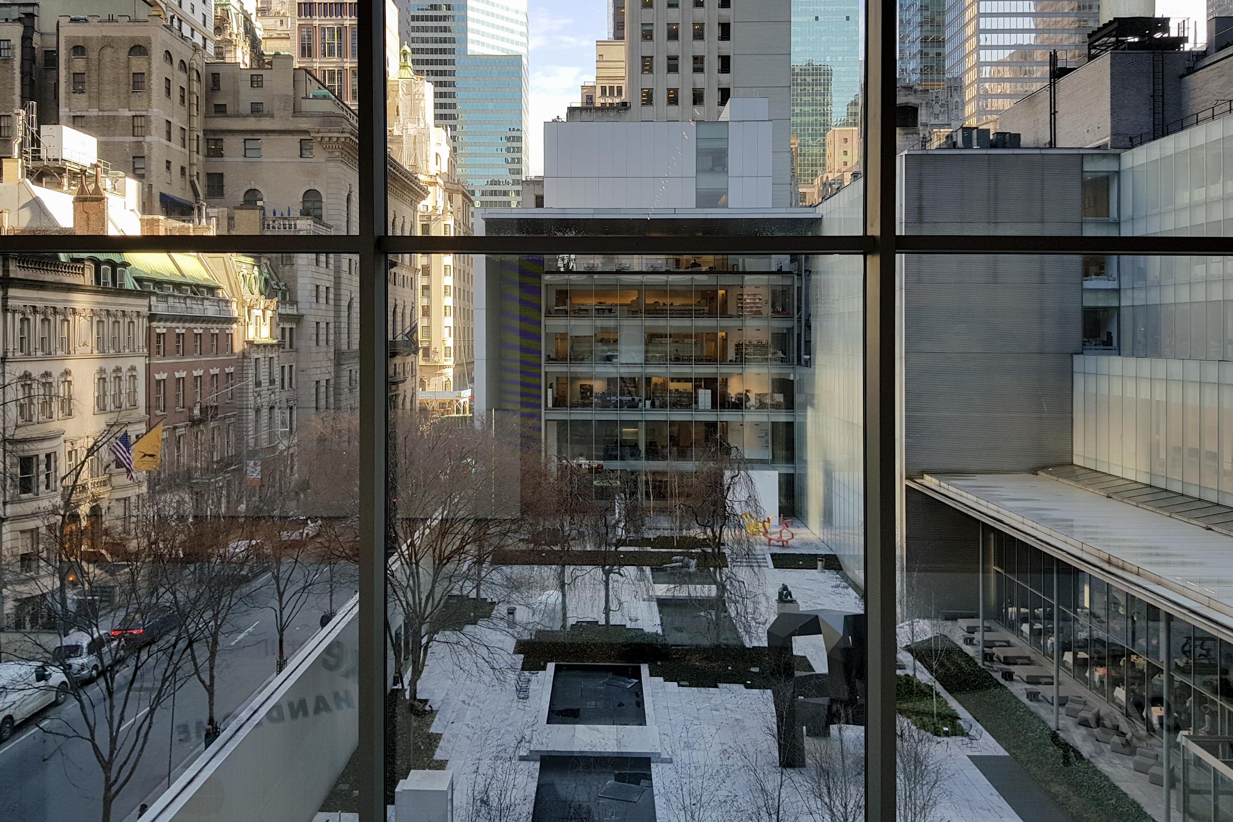 Looking out a window to the Moma Sculpture garden in Manhattan