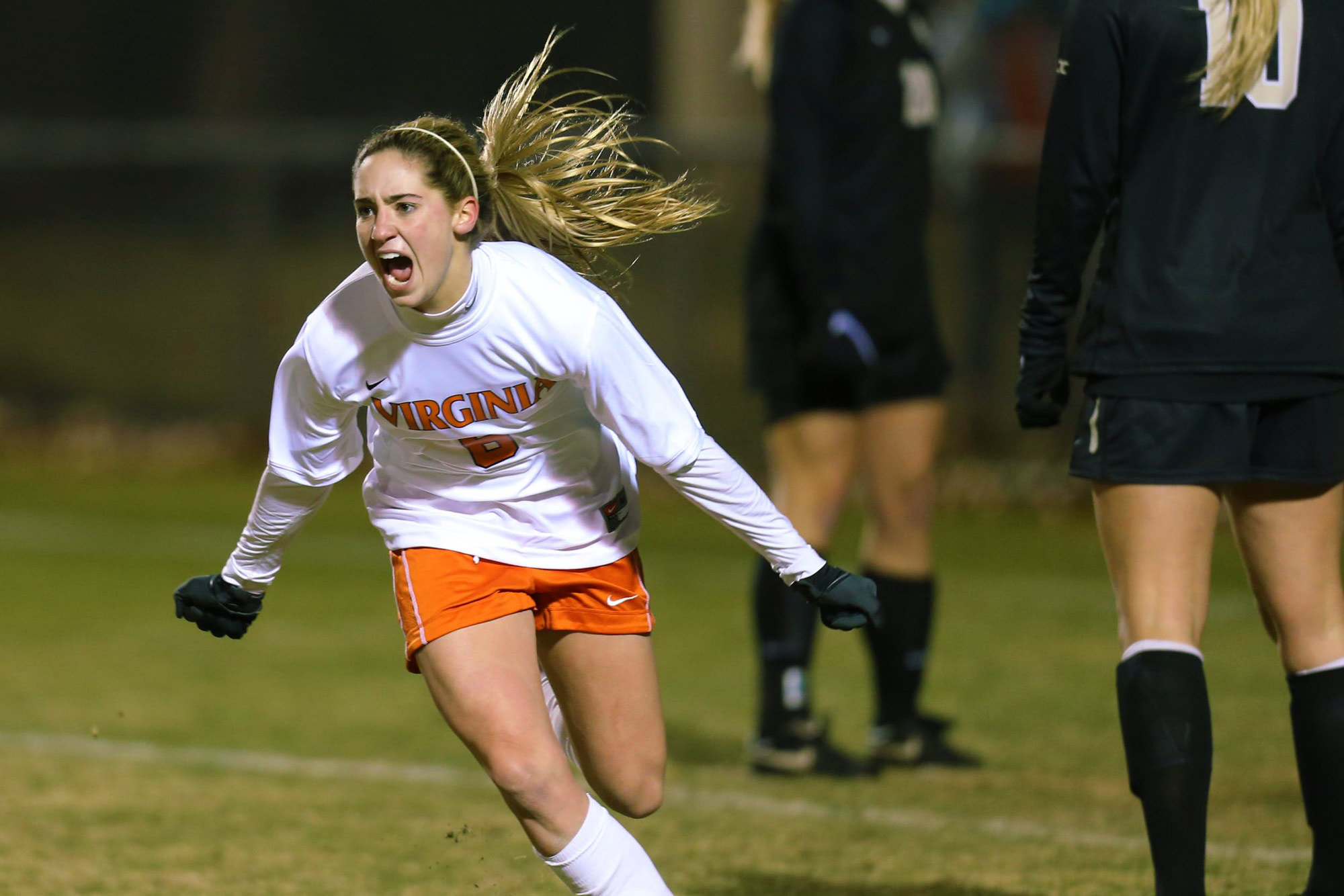 Morgan Brian running on the soccer field screaming with excitement