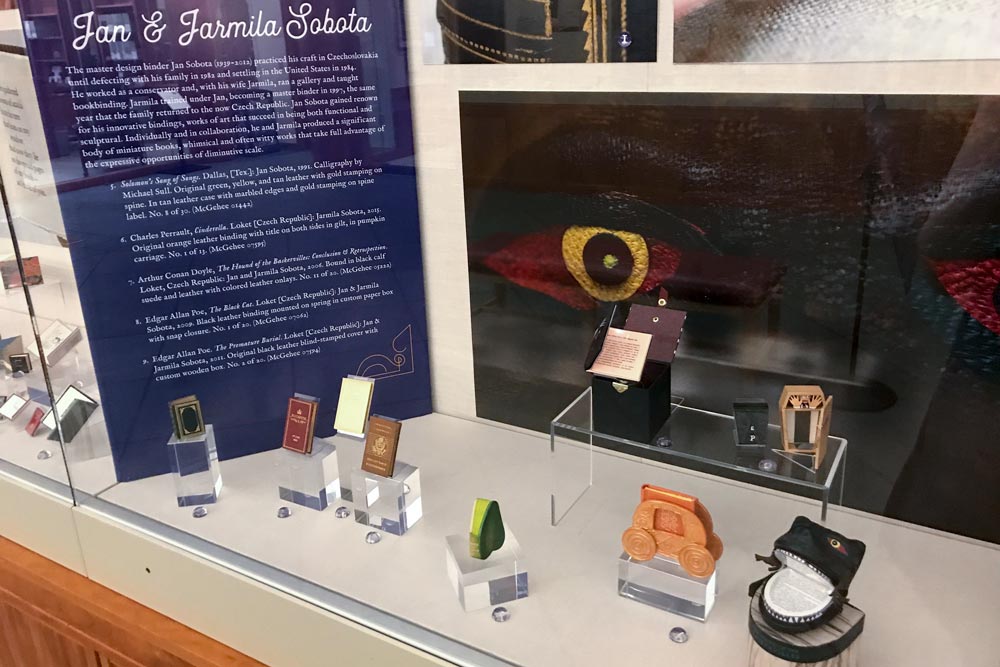Exhibit of mini books with mini books and book cases displayed