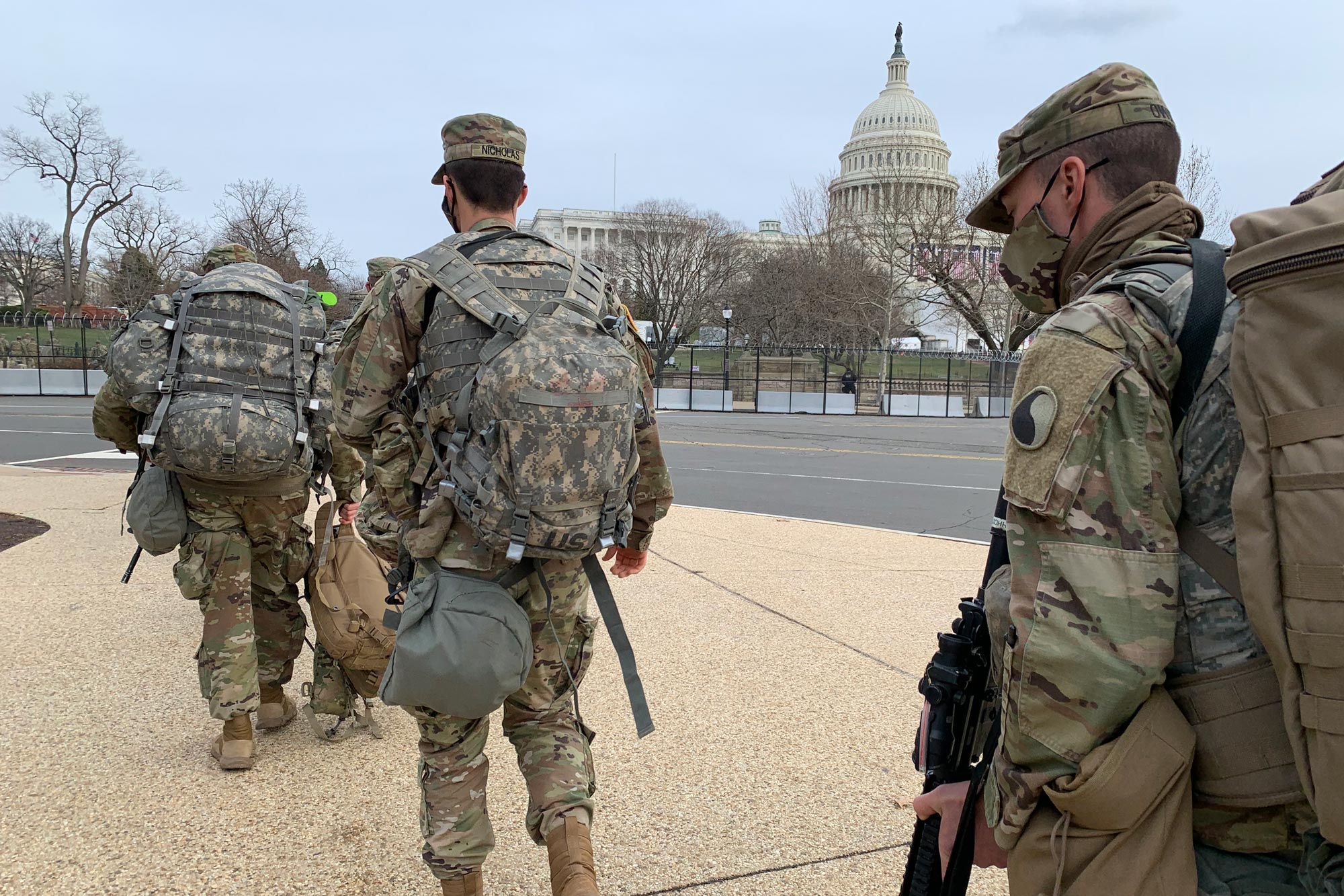 National Guardsmen walking the streets of Washington DC to the US Capitol building