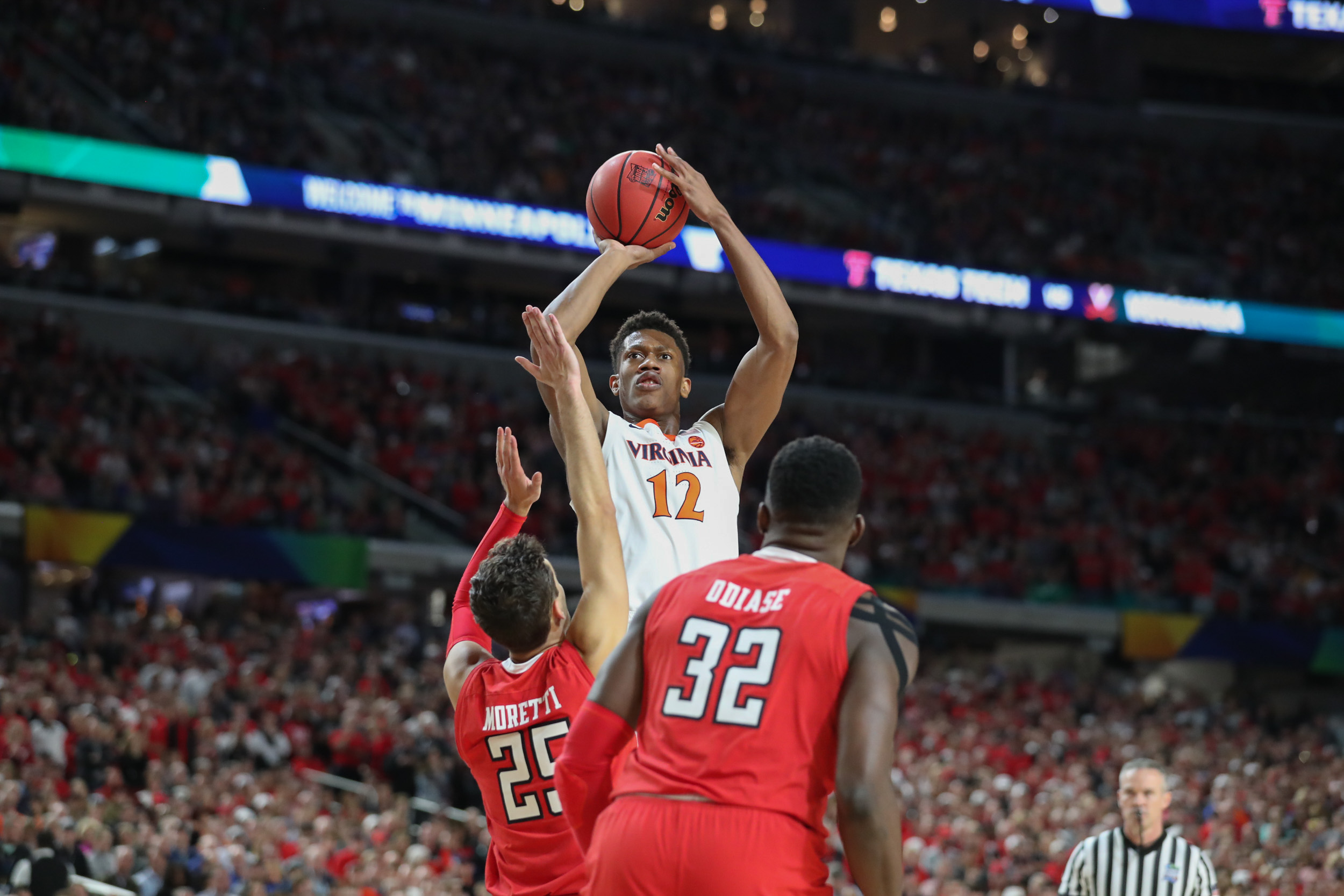 UVA basketball player shooting during a game