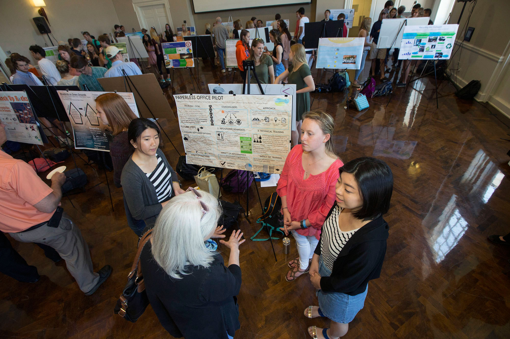 Students in a global sustainability class present their proposals for initiatives during an Earth Week Exposition in the Newcomb Hall Ballroom on Wednesday.
