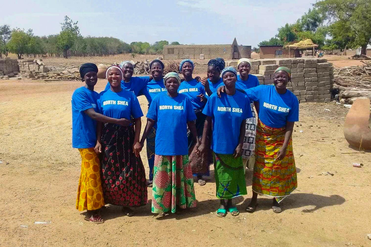 ten women in Ghana stand together for a picture