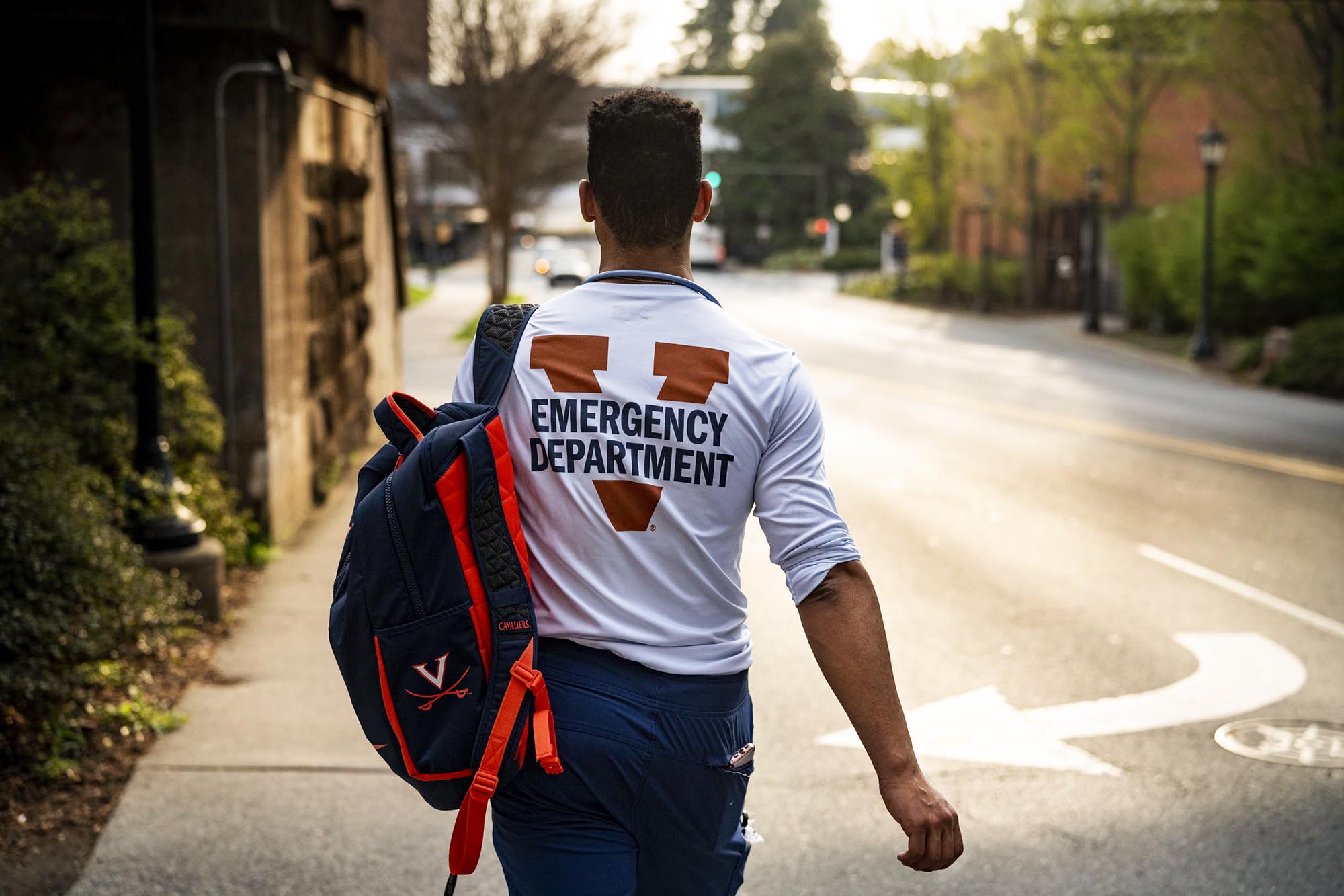 Billy Burris walking down the sidewalk. His shirt says Emergency Department