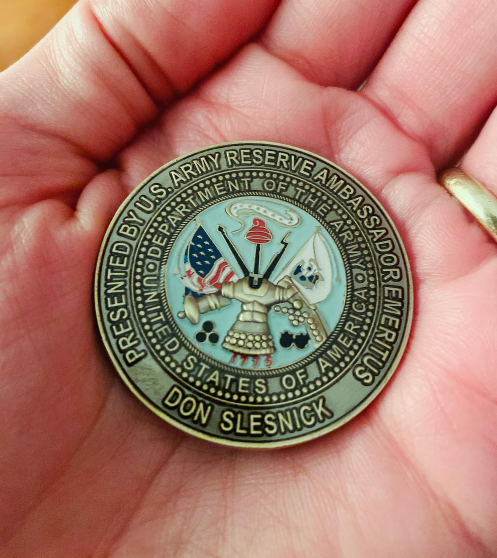 Military coin that reads: presented by U.S. Army Reserve Ambassador Emeritus Don Slesnick, Department of the Army United States of America