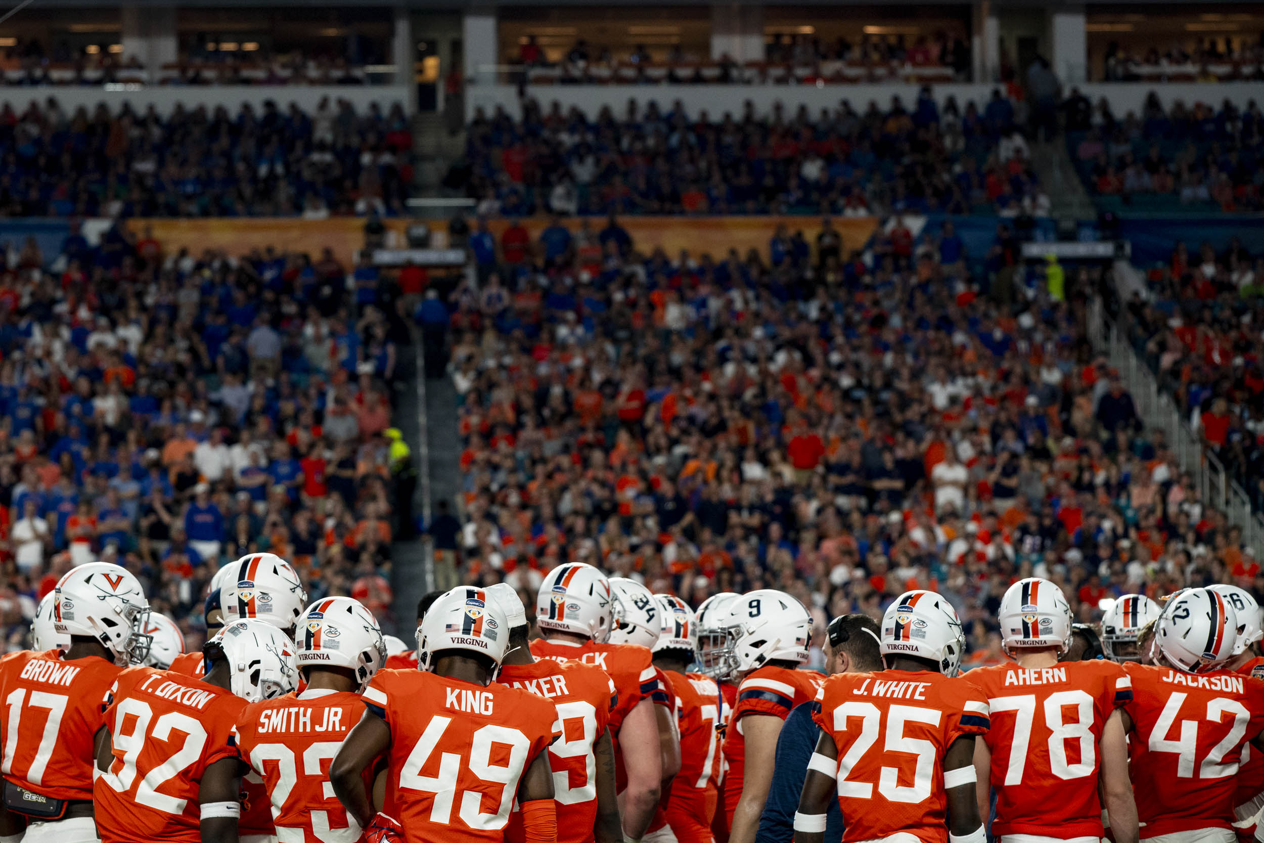 UVA football team huddled up during a game