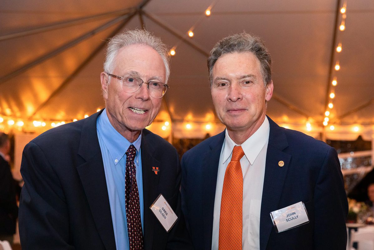 Alumnus Greg Olsen, left, and John R. Scully, right, stand together for a picture