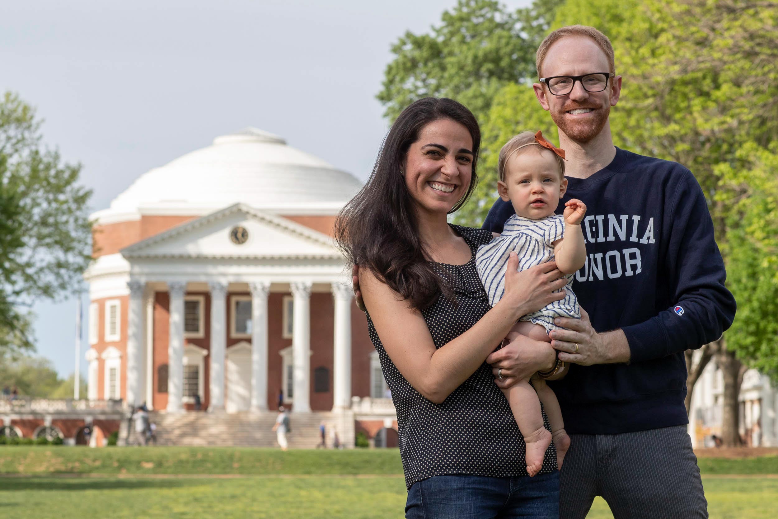 Ory Streeter, Michelle Streeterand their 11-month-old daughter Mila stand for a picture in front of the Rotunda