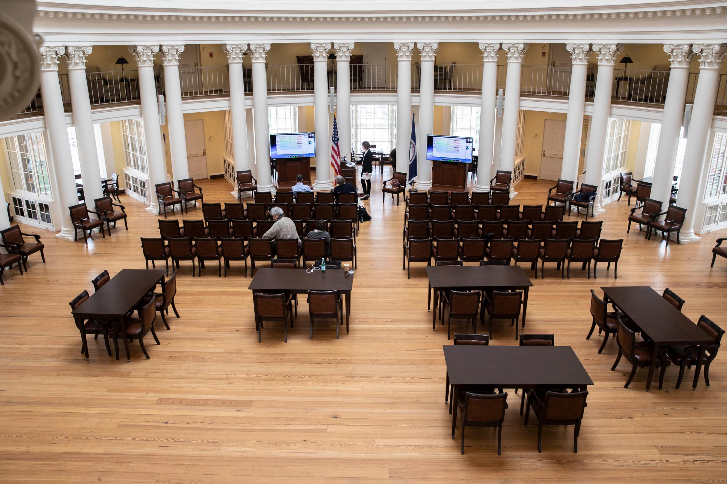 The Rotunda mostly empty with chairs and screens set up in preparation of a speech