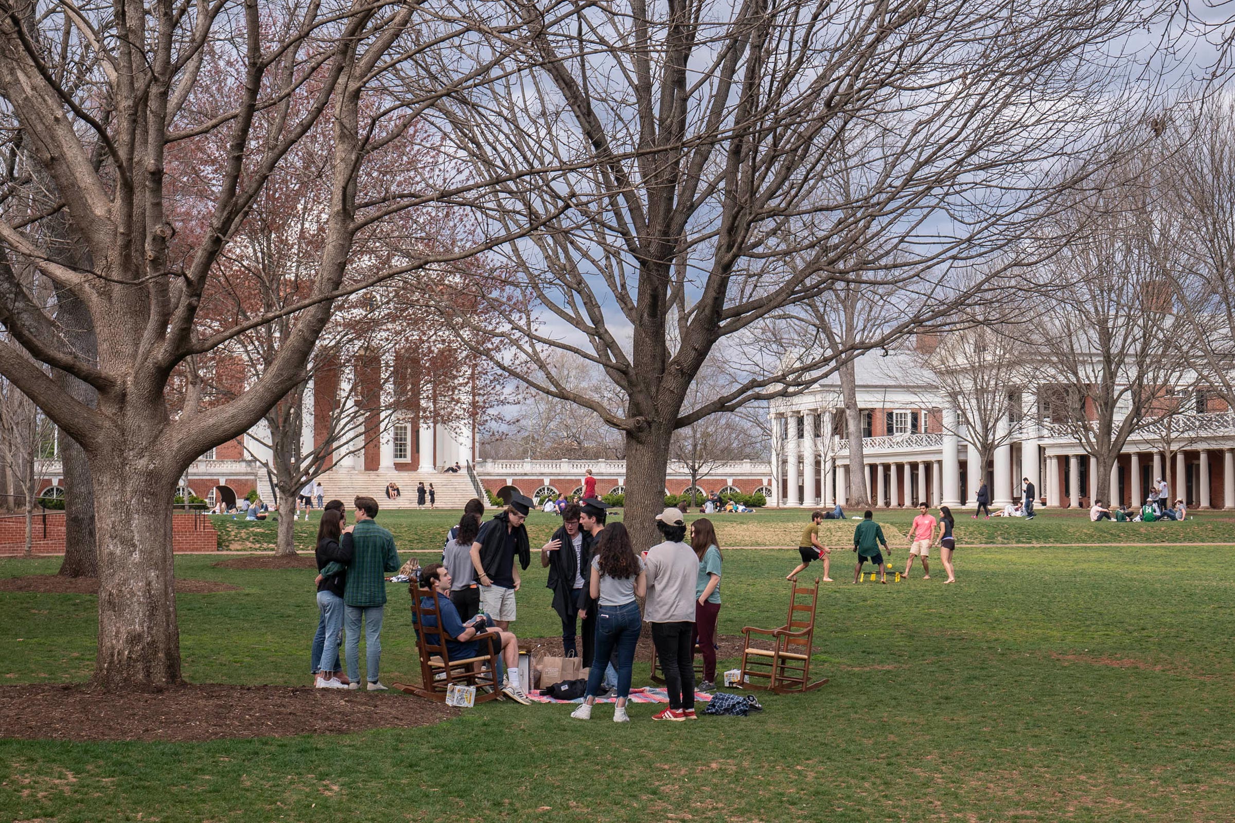 Groups of students gathering on the Lawn playing games and talking
