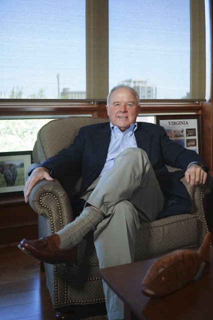 Paul Manning sitting in a chair smiling at the camera