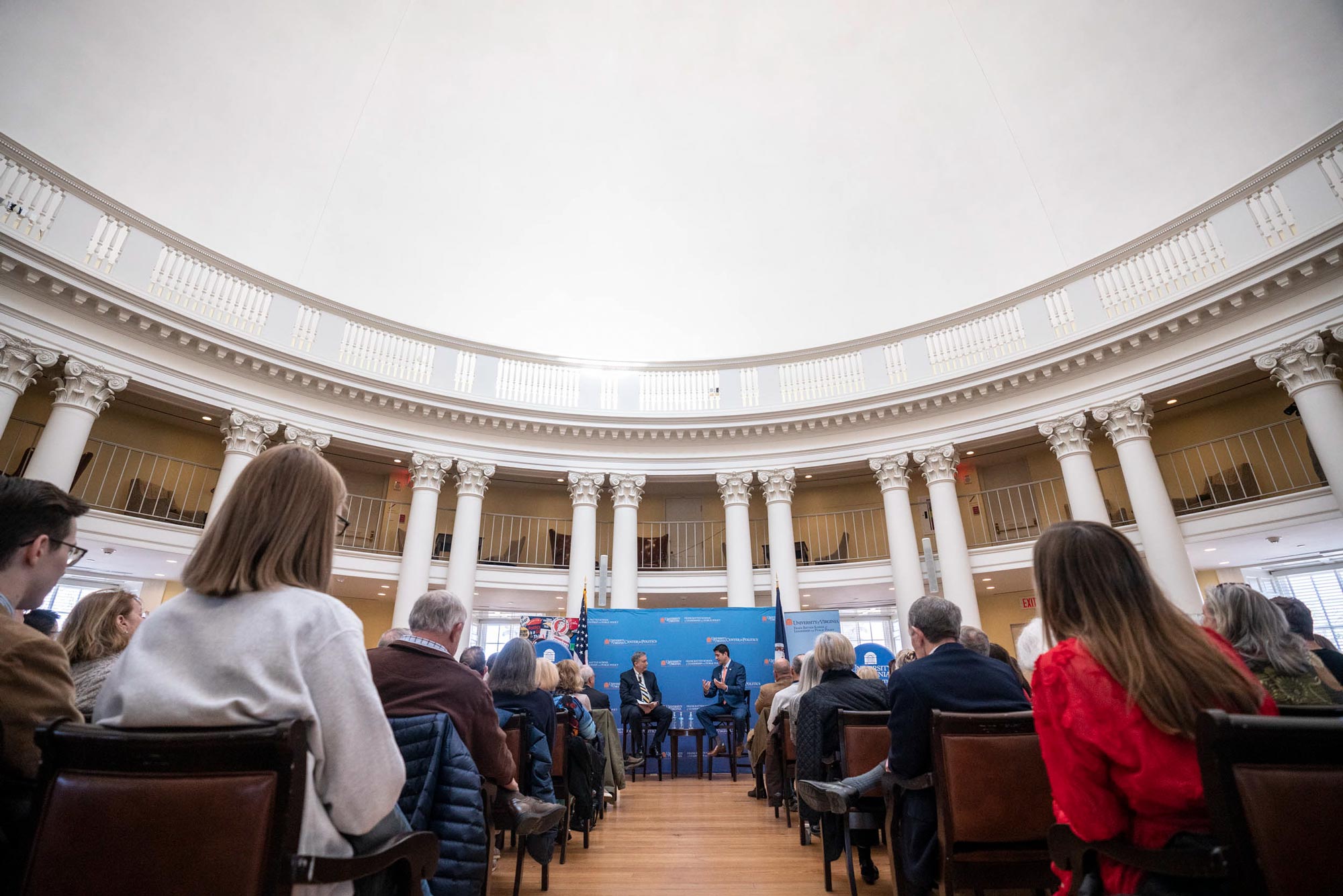 Paul Ryan, right, and Larry Sabato, left at the front of the room speaking to a large audience inside of the Rotunda