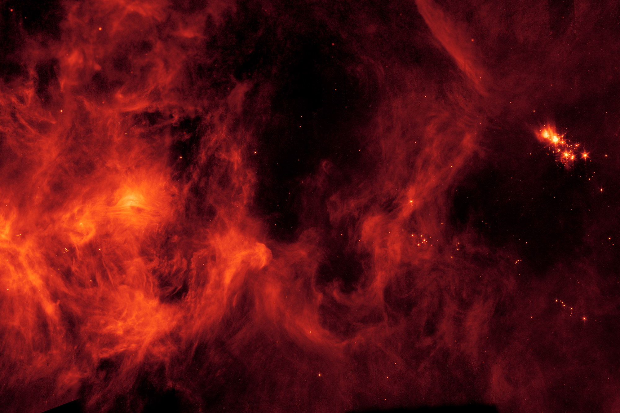 A collection of red gas and dust in space