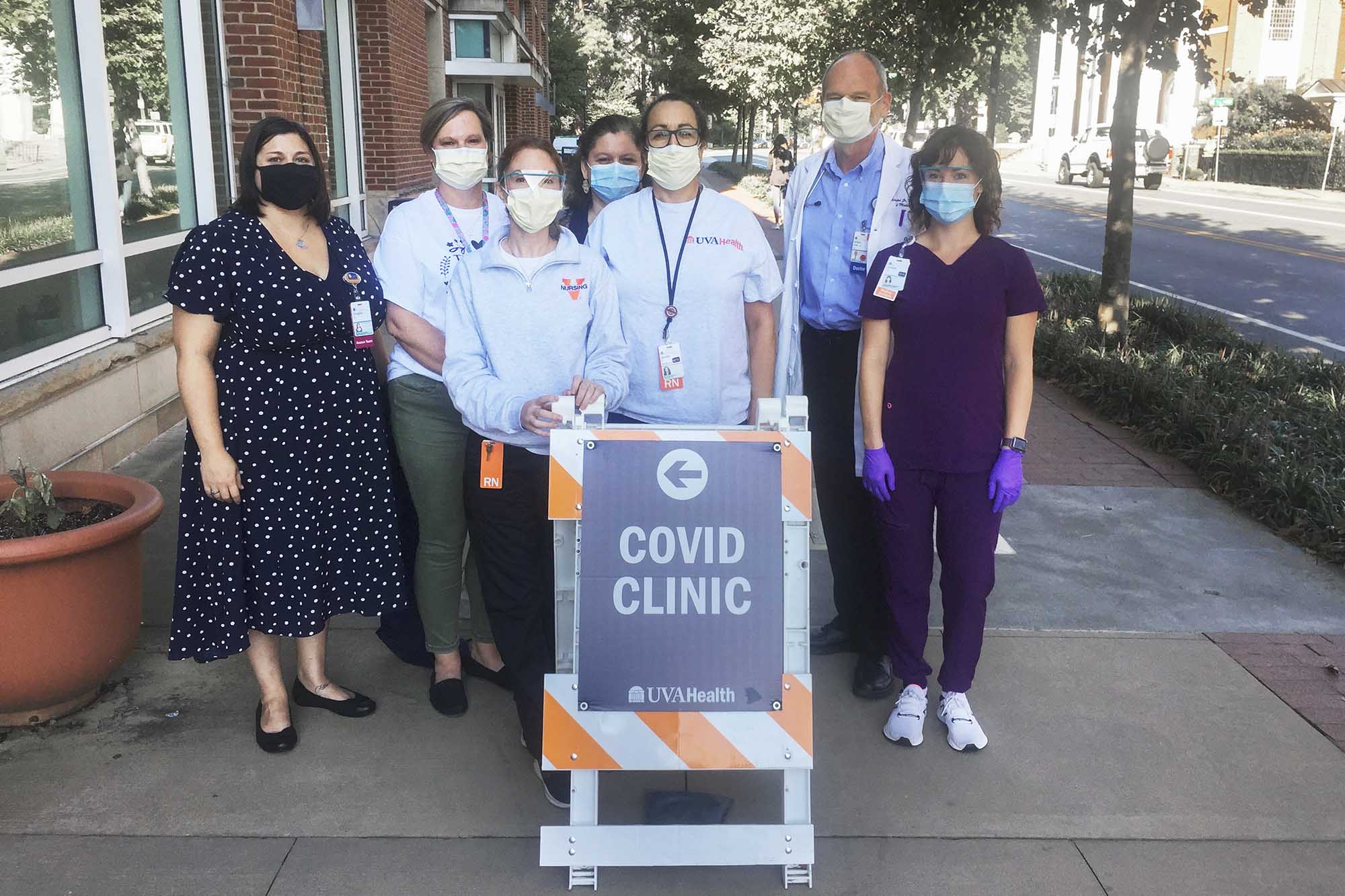 Bridgette Arlook, Christy Breeden, Rebecca Wade, Crystal Reed, Jennifer Pinnata, William Petri Jr. and Andrea Stanley pose together for a group photo at a covid clinic