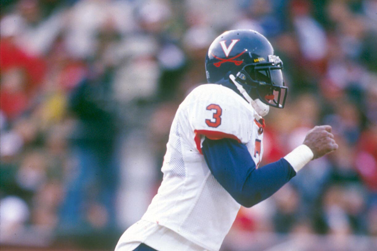 Poindexter running on the football field during a game