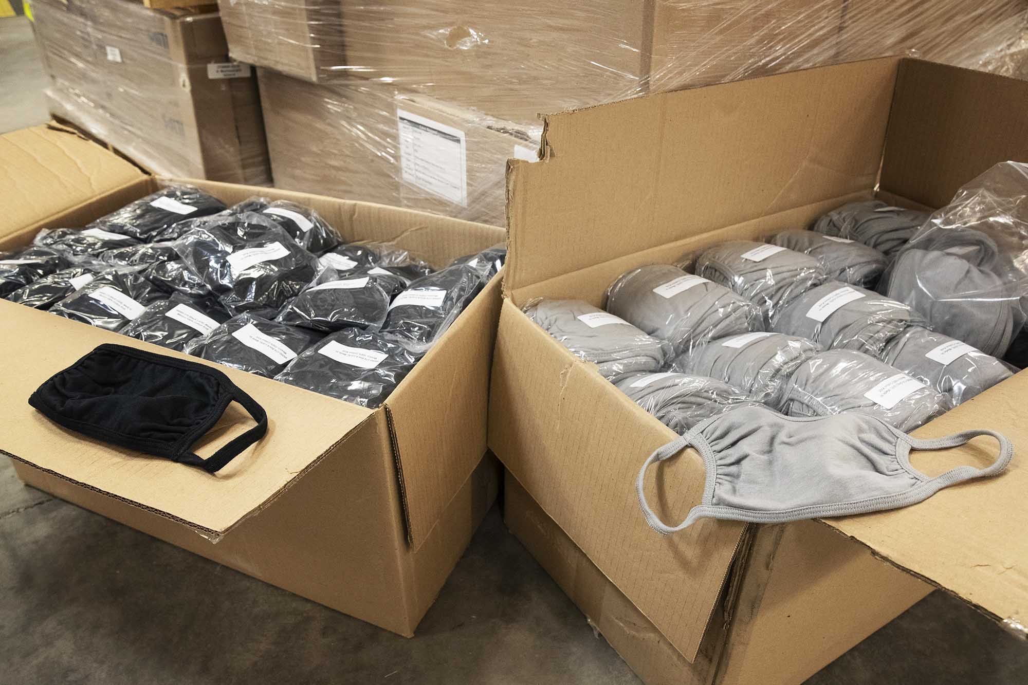 Boxes filled with thousands of gray and black masks