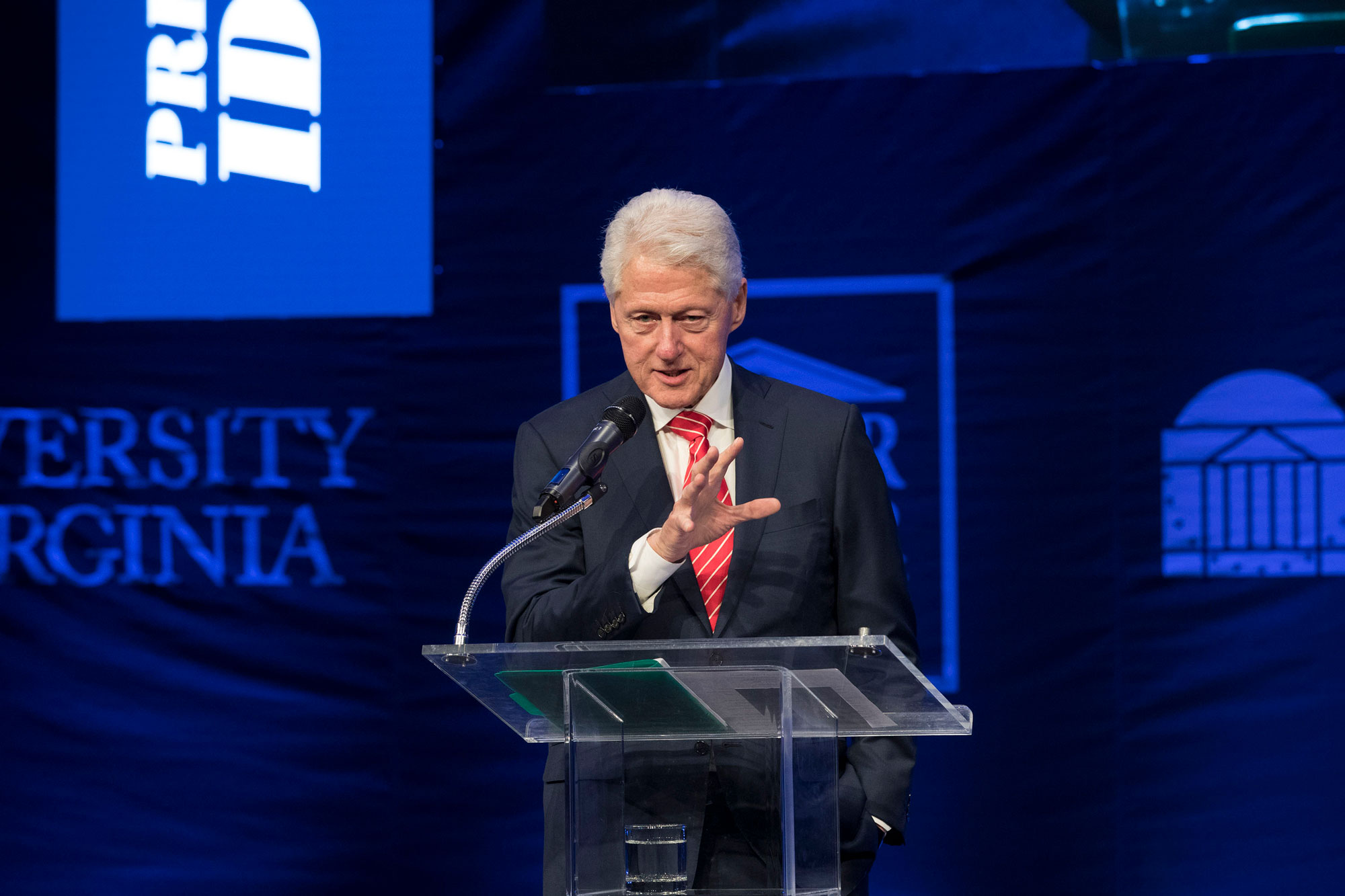 Former President Bill Clinton stands at a podium talking